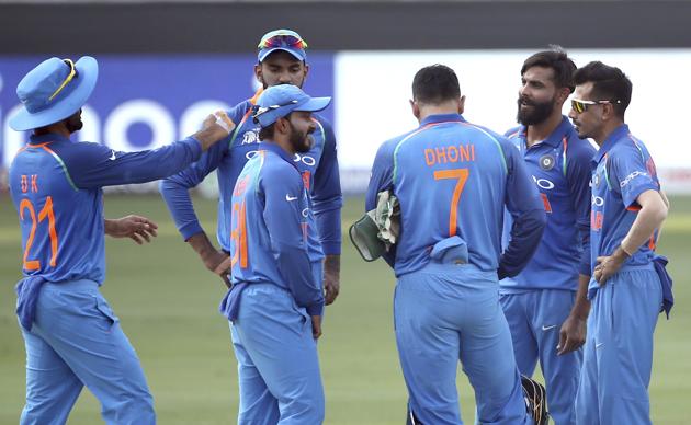 India's Ravindra Jadeja, second right, celebrates with teammates the dismissal of Afghanistan's Javed Ahmadi. (AP)
