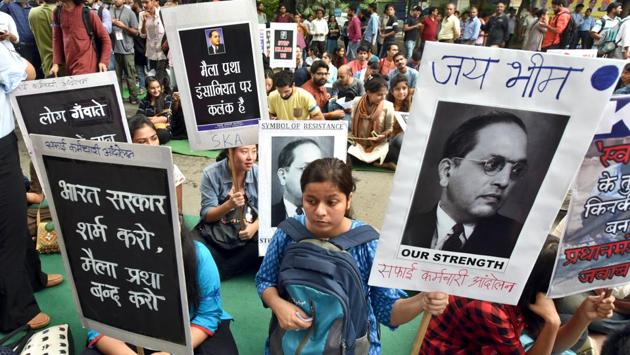 Manual scavengers and their families gather at Jantar Mantar to protest against the Centre and state governments for not implementing the ban on manual scavenging as mandated in the Prohibition of Employment of Manual Scavengers and their Rehabilitation Act, 2013. (Sushil Kumar / HT Photo) Manual scavengers and their families gather at Jantar Mantar to protest against the Centre and state governments for not implementing the ban on manual scavenging as mandated in the Prohibition of Employment of Manual Scavengers and their Rehabilitation Act, 2013. (Sushil Kumar / HT Photo)