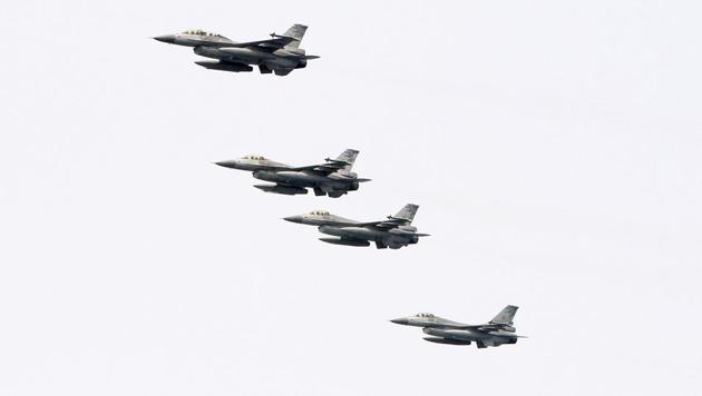 Taiwanese F-16 jet fighters fly in close formation during a navy exercise at Suao naval station in Yilan County, northeastern Taiwan. China demanded Tuesday, September 25, 2018, that the US cancel a $330 million sale of military equipment to Taiwan, warning of "severe damage" to bilateral relations and cooperation if Washington fails to comply. (AP File Photo) Taiwanese F-16 jet fighters fly in close formation during a navy exercise at Suao naval station in Yilan County, northeastern Taiwan. China demanded Tuesday, September 25, 2018, that the US cancel a $330 million sale of military equipment to Taiwan, warning of "severe damage" to bilateral relations and cooperation if Washington fails to comply. (AP File Photo)
