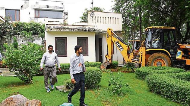 On Tuesday, the government’s revenue department demolished at least 60 illegally built structures and sealed three farmhouses that had come up on forest land in south Delhi’s Bhati village. (HT Photo) On Tuesday, the government’s revenue department demolished at least 60 illegally built structures and sealed three farmhouses that had come up on forest land in south Delhi’s Bhati village. (HT Photo)