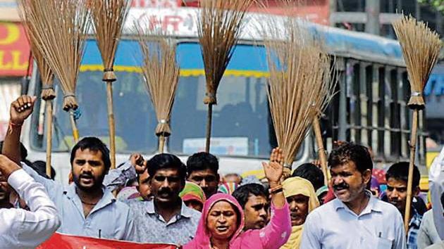 Sanitation workers have been demanding the implementation of their demands, including pay hike and regularisation of contractual workers, the state government agreed to in May. (HT File Photo) Sanitation workers have been demanding the implementation of their demands, including pay hike and regularisation of contractual workers, the state government agreed to in May. (HT File Photo)