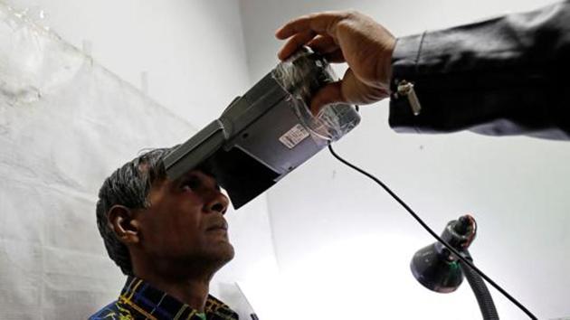 A man goes through the process of eye scanning for the Unique Identification database system, also known as Aadhaar, at a registration centre in New Delhi(REUTERS FILE) A man goes through the process of eye scanning for the Unique Identification database system, also known as Aadhaar, at a registration centre in New Delhi(REUTERS FILE)
