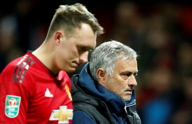 Manchester United's Phil Jones and manager Jose Mourinho look dejected after Derby County win the penalty shootout(REUTERS)