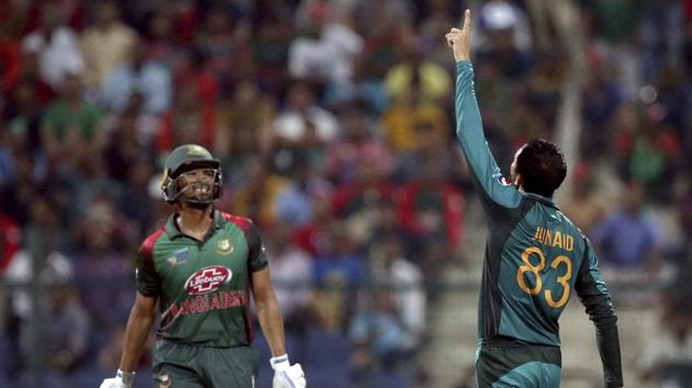 Pakistan's Junaid Khan, right, celebrates the dismissal of Bangladesh's Mahmudullah (AP)