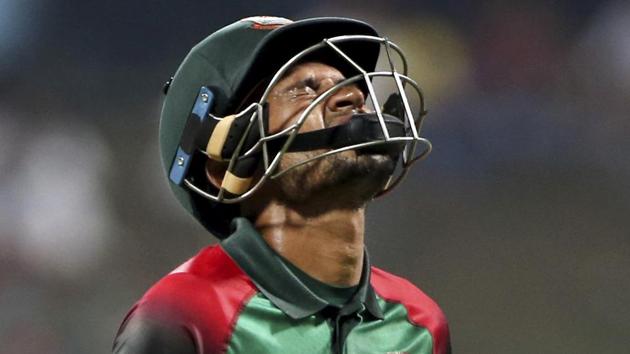 Bangladesh's Mushfiqur Rahim reacts as he leaves the field after being dismissed during the one day international cricket match of Asia Cup between Pakistan and Bangladesh in Abu Dhabi.(AP)