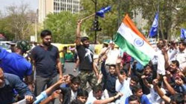Dalits stage a protest during 'Bharat Bandh' against Supreme Court judgement diluting provisions of the SC/ST Atrocities Act, New Delhi, April 2, 2018 (Arvind Yadav/HT PHOTO) Dalits stage a protest during 'Bharat Bandh' against Supreme Court judgement diluting provisions of the SC/ST Atrocities Act, New Delhi, April 2, 2018 (Arvind Yadav/HT PHOTO)