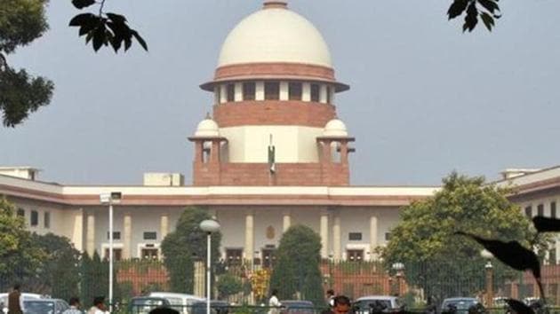 The Supreme Court on Wednesday upheld the legality of Aadhaar restricting it to disbursement of social benefits and junking its requirement for cell phones and bank accounts.(Reuters)