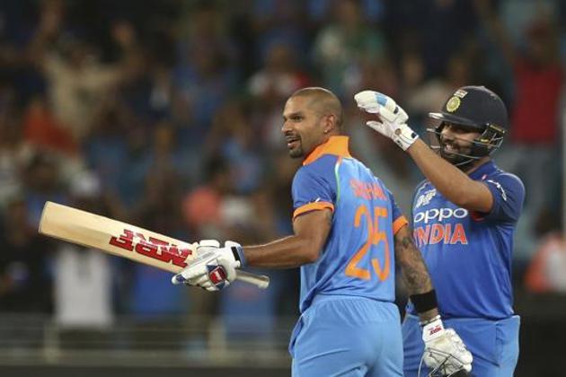 India's captain Rohit Sharma, right, congratulates teammate Shikhar Dhawan on scoring a century during the one day international cricket match of Asia Cup between India and Pakistan in Dubai, United Arab Emirates. (AP)