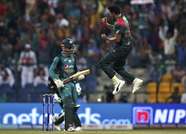 Bangladesh's Soumya Sarkar, right, leaps in the air to celebrate the dismissal of Pakistan's Shadab Khan. (AP)