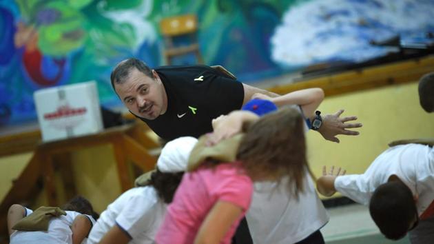 A teacher teaches gymnastics to his pupils. The slogan “get addicted to fruit” adorns the walls of the school and fruit is given out every morning. Pineiro said that they don’t ever talk about weight directly to the children, as it would have a stigmatising effect. Beyond the 100,000-kilo weight loss challenge, he hopes residents will adopt healthy lifestyles which would also reduce health spending. (Miguel Riopa / AFP) A teacher teaches gymnastics to his pupils. The slogan “get addicted to fruit” adorns the walls of the school and fruit is given out every morning. Pineiro said that they don’t ever talk about weight directly to the children, as it would have a stigmatising effect. Beyond the 100,000-kilo weight loss challenge, he hopes residents will adopt healthy lifestyles which would also reduce health spending. (Miguel Riopa / AFP)