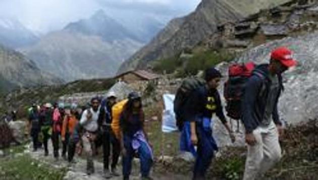 A group from Mumbai heading towards Dronagiri hill. Uttarakhand tourism department recently organized a trekking camp. (HT Representative Photo)