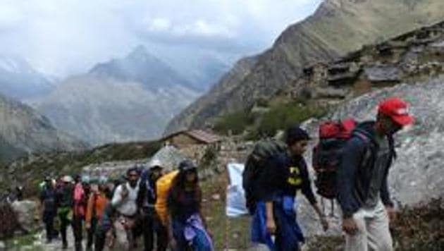 A group from Mumbai heading towards Dronagiri hill. Uttarakhand tourism department recently organized a trekking camp.(HT File Photo)