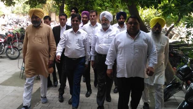 AAP MLA Naresh Yadav and LOP Harpal Cheema outside Sangrur court on Friday. (HT Photo) AAP MLA Naresh Yadav and LOP Harpal Cheema outside Sangrur court on Friday. (HT Photo)