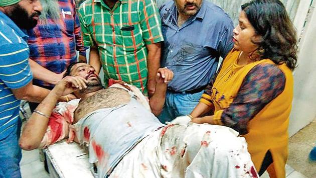 Himachal INTUC president Hardeep Singh Bawa being taken to a hospital after the attack in Solan on Thursday. (HT Photo) Himachal INTUC president Hardeep Singh Bawa being taken to a hospital after the attack in Solan on Thursday. (HT Photo)
