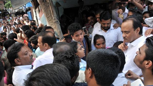 NCP leader Ajit Pawar meet affected people of Mutha canal burst near Dandekar bridge in Pune. (HT PHOTO) NCP leader Ajit Pawar meet affected people of Mutha canal burst near Dandekar bridge in Pune. (HT PHOTO)