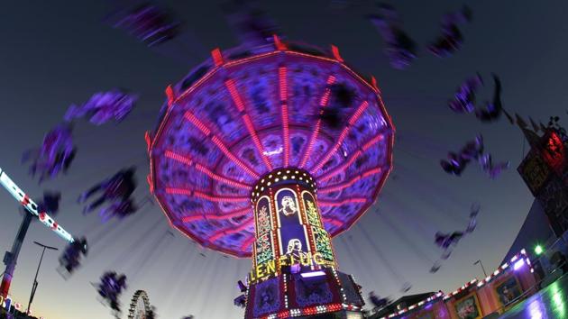 People enjoy a swing ride at the 185th Oktoberfest beer festival in Munich, Germany. (Matthias Schrader / AP) People enjoy a swing ride at the 185th Oktoberfest beer festival in Munich, Germany. (Matthias Schrader / AP)
