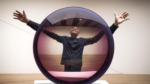 Artist Fred Eversley poses with his piece, ‘Untitled (Parabolic Lens) 1971’ during a press preview for the exhibition ‘Space Shifters at the Hayward Gallery’, at the Southbank Centre, London, England. (Victoria Jones / PA via AP) Artist Fred Eversley poses with his piece, ‘Untitled (Parabolic Lens) 1971’ during a press preview for the exhibition ‘Space Shifters at the Hayward Gallery’, at the Southbank Centre, London, England. (Victoria Jones / PA via AP)