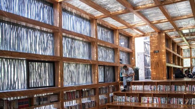 A man reads a book at Liyuan Library on the outskirts of Beijing. (Fred Dufour / AFP) A man reads a book at Liyuan Library on the outskirts of Beijing. (Fred Dufour / AFP)