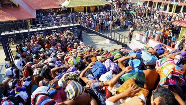 Devotees gather at the Sabarimala Ayyappa Temple in Pathanamthitta, Kerala.(PTI)