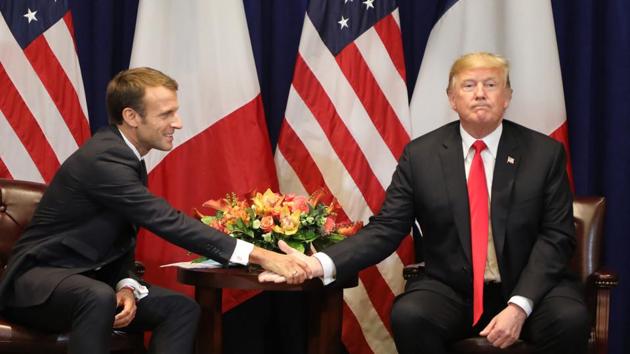 French President Emmanuel Macron (L) shakes hands with US President Donald Trump at the start of a bilateral meeting in New York, a day before the start of the General Debate of the 73rd session of the General Assembly. (Ludovic Marin / AFP) French President Emmanuel Macron (L) shakes hands with US President Donald Trump at the start of a bilateral meeting in New York, a day before the start of the General Debate of the 73rd session of the General Assembly. (Ludovic Marin / AFP)