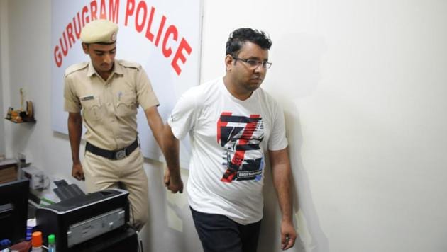 Kedarnath Sagar Sharma (in white t-shirt) posed as a senior civil judge from Telangana and started conning people in Delhi and Gurugram by promising them government jobs, flats and admissions in central government-run schools, using his “influence”. (Parveen Kumar/HT Photo) Kedarnath Sagar Sharma (in white t-shirt) posed as a senior civil judge from Telangana and started conning people in Delhi and Gurugram by promising them government jobs, flats and admissions in central government-run schools, using his “influence”. (Parveen Kumar/HT Photo)