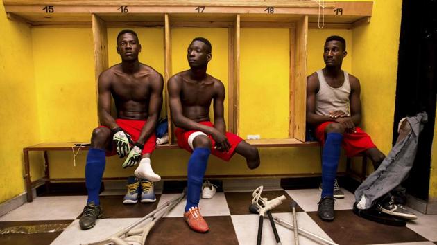 Players of the Haitian football selection of players with amputated limbs gather in the locker room of the Parc Sainte-Thérèse in Pétion-ville, preparing for a fundraising match. The country has its eyes set on victory in November’s amputee World Cup. (Pierre Michel Jean / AFP) Players of the Haitian football selection of players with amputated limbs gather in the locker room of the Parc Sainte-Thérèse in Pétion-ville, preparing for a fundraising match. The country has its eyes set on victory in November’s amputee World Cup. (Pierre Michel Jean / AFP)