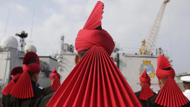Indian army soldiers of Jammu and Kashmir Light Infantry Regiment stand on the deck of Indian Naval Ship Kochi during their affiliation ceremony on the shore of the Arabian sea in Mumbai, Maharashtra. (Rafiq Maqbool / AP)