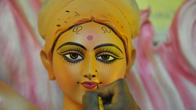 An artist gives the final touches to a statue of the goddess Durga ahead the forthcoming Dushhera-Vijaya Dashami festival at a workshop in Hyderabad, Telangana. (Noah Seelam / AFP)
