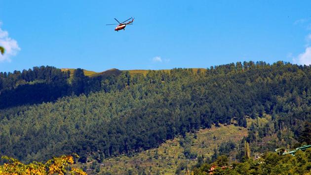 An Indian Air Force helicopter flies towards Lahaul from Kullu to rescue stranded people in the region of Lahaul and Spiti district, Himachal Pradesh. (PTI)