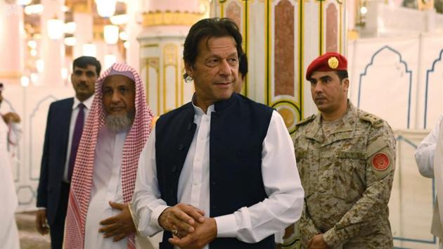 Pakistani Prime Minister Imran Khan, center, visits the Prophet's Mosque in Medina, Saudi Arabia on September 18. (AP Photo) Pakistani Prime Minister Imran Khan, center, visits the Prophet's Mosque in Medina, Saudi Arabia on September 18. (AP Photo)