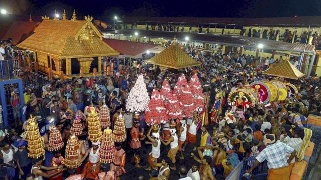 In this file photo dated Dec 24, 2014, a 'Karppoorazhi' procession is being taken out at Lord Ayyappa temple, in Sabarimala. Supreme Court on Friday, Sept 28, 2018, announced it verdict allowing entry of women of all ages at the Sabarimala temple. (PTI) In this file photo dated Dec 24, 2014, a 'Karppoorazhi' procession is being taken out at Lord Ayyappa temple, in Sabarimala. Supreme Court on Friday, Sept 28, 2018, announced it verdict allowing entry of women of all ages at the Sabarimala temple. (PTI)