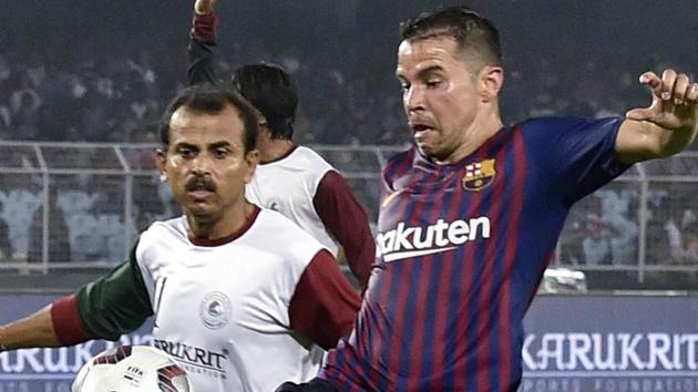 Barcelona Legends (in striped jersey) and Mohun Bagan during a football match in Kolkata. (PTI) Barcelona Legends (in striped jersey) and Mohun Bagan during a football match in Kolkata. (PTI)
