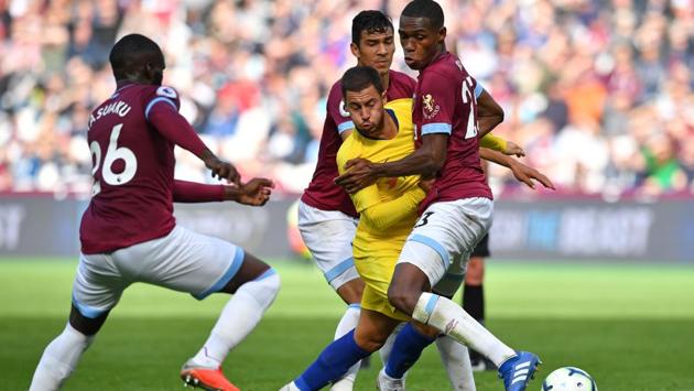 Chelsea’s Belgian midfielder Eden Hazard (C) vies with West Ham United’s French defender Arthur Masuaku (L), Paraguayan defender Fabián Balbuena and French defender Issa Diop (R) during the English Premier League football match between the teams at The London Stadium, in England. (Ben Stansall / AFP) Chelsea’s Belgian midfielder Eden Hazard (C) vies with West Ham United’s French defender Arthur Masuaku (L), Paraguayan defender Fabián Balbuena and French defender Issa Diop (R) during the English Premier League football match between the teams at The London Stadium, in England. (Ben Stansall / AFP)