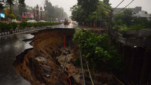 A collapsed road due to heavy rain is seen in Amritsar, Punjab. (Narinder Nanu / AFP)