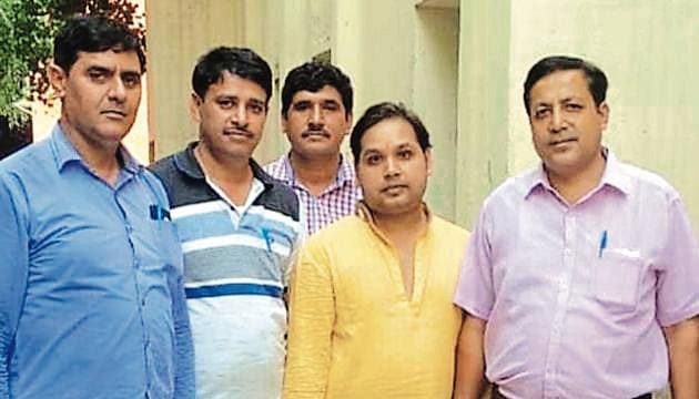 Pulkit Mishra, alias Pulkit Maharaj (in yellow shirt), would allegedly pass himself off as the ‘spiritual guru’ of Narendra Modi. (Picture courtesy: Sourced) Pulkit Mishra, alias Pulkit Maharaj (in yellow shirt), would allegedly pass himself off as the ‘spiritual guru’ of Narendra Modi. (Picture courtesy: Sourced)