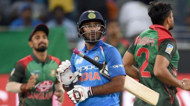 Indian batsman Ambati Rayudu (C) leaves the field after being dismissed by Bangladesh cricket captain Mashrafe Mortaza (R). (AFP) Indian batsman Ambati Rayudu (C) leaves the field after being dismissed by Bangladesh cricket captain Mashrafe Mortaza (R). (AFP)