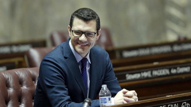 In this Jan. 27, 2017 photo, Senate Republican floor leader Joe Fain, R-Auburn, sits at his desk on the Senate floor in Olympia, Wash. (AP) In this Jan. 27, 2017 photo, Senate Republican floor leader Joe Fain, R-Auburn, sits at his desk on the Senate floor in Olympia, Wash. (AP)