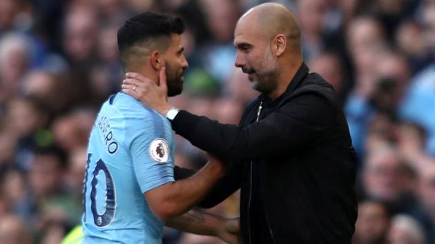 Manchester City's Sergio Aguero with manager Pep Guardiola after being substituted off.(REUTERS)