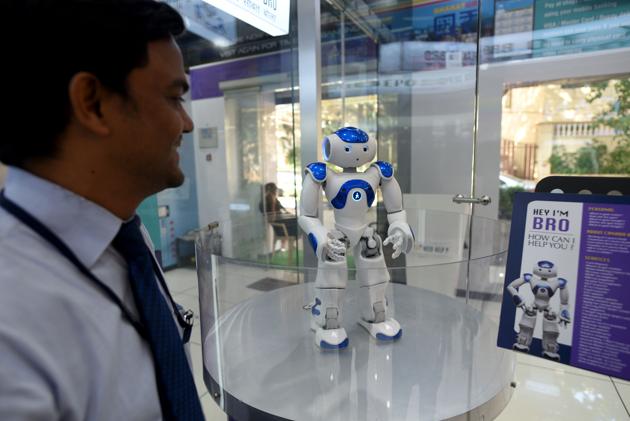 Bro is a humanoid deployed by Canara Bank, at their digital banking branch in Mumbai, who greets visitors, answers questions and signs off with a warm “Cheerio!”(Satyabrata Tripathy/HT Photo)