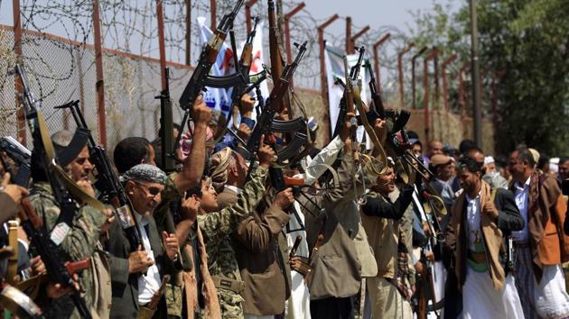 Tribal gunmen loyal to the Huthi rebels brandish their weapons during a gathering in Sanaa.(AFP)