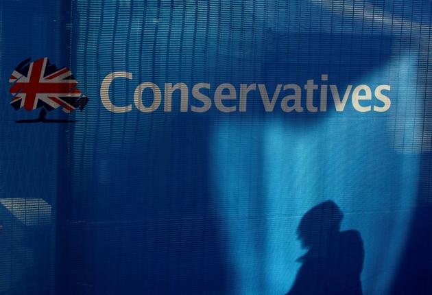 The silhouette of an arrival at the conference centre, is seen on a barrier positioned on the perimeter ahead of the Conservative Party Conference in Birmingham. (Reuters File Photo) The silhouette of an arrival at the conference centre, is seen on a barrier positioned on the perimeter ahead of the Conservative Party Conference in Birmingham. (Reuters File Photo)