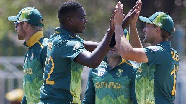 South Africa's Lungi Ngidi (L) celebrates after dismissing Zimbabwe's Kyle Jarvis during the first One Day International.(AFP)