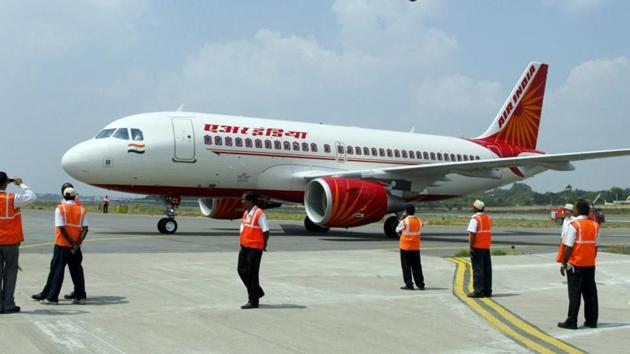 Ground crew standing next to a newly-inducted Air India Airbus A319 aircraft at Begumpet Airport in Hyderabad. (AFP File Photo) Ground crew standing next to a newly-inducted Air India Airbus A319 aircraft at Begumpet Airport in Hyderabad. (AFP File Photo)