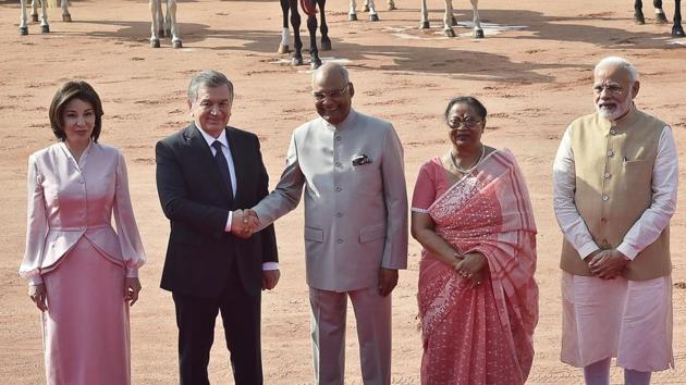 Uzbekistan’s President Shavkat Mirziyoyev meets with President Ramnath Kovind (C) as Ziroatkhon Hoshimova (L), Savita Kovind (2R) and Prime Minister Narendra Modi (R) look on, during Mirziyoyev’s reception at the forecourt of Rashtrapati Bhavan. India and Uzbekistan will jointly work together and strive for a stable, prosperous and peaceful Afghanistan, said PM Modi on Monday. (Ajay Aggarwal / HT Photo)
