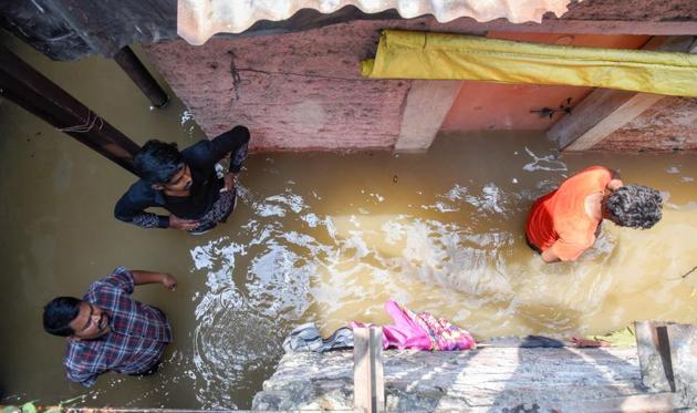 As a result of the disaster, there was flooding in the area, inundating nearly 350 homes with knee-deep to waist-deep water, destroying a few shanties, and damaging vehicles parked outside and things kept inside. (SANKET WANKHADE/HT PHOTO) As a result of the disaster, there was flooding in the area, inundating nearly 350 homes with knee-deep to waist-deep water, destroying a few shanties, and damaging vehicles parked outside and things kept inside. (SANKET WANKHADE/HT PHOTO)