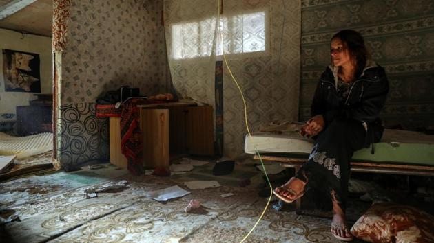 Veronica Radu, 24, sits in her bedroom as she waits to be relocated from El Gallinero. The “Gallinero” or “chicken coop” had stood on the side of a motorway leading out of the capital since the early 2000s, a fragile mass of corrugated roofs, mangled wires and rotting garbage. (Susana Vera / REUTERS) 