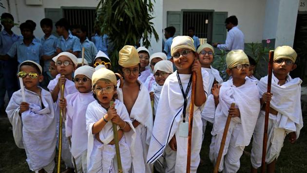 Students dressed as Mahatma Gandhi take part in an event to mark Gandhi’s 150th birth anniversary, at a school in Ahmedabad. (Amit Dave / REUTERS)