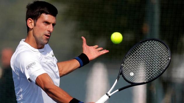 Serbia's tennis player Novak Djokovic returns the ball during a training session in Belgrade.(AFP)