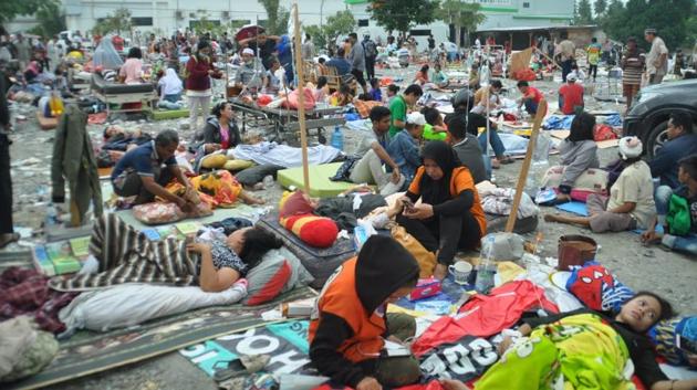Medical team members help patients outside a hospital after the tsunami. Television pictures showed scores of residents shouting “we’re hungry, we need food” as soldiers distributed rations from a truck in one neighbourhood, while footage from elsewhere showed people making off with clothes and other items from a wrecked mall. (AFP) Medical team members help patients outside a hospital after the tsunami. Television pictures showed scores of residents shouting “we’re hungry, we need food” as soldiers distributed rations from a truck in one neighbourhood, while footage from elsewhere showed people making off with clothes and other items from a wrecked mall. (AFP)