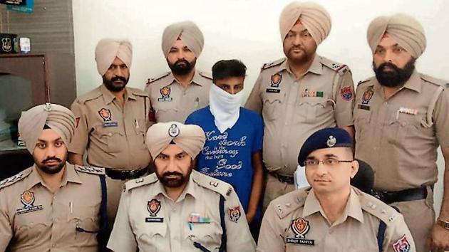 The accused in police custody in Ludhiana on Monday. (HT Photo) The accused in police custody in Ludhiana on Monday. (HT Photo)